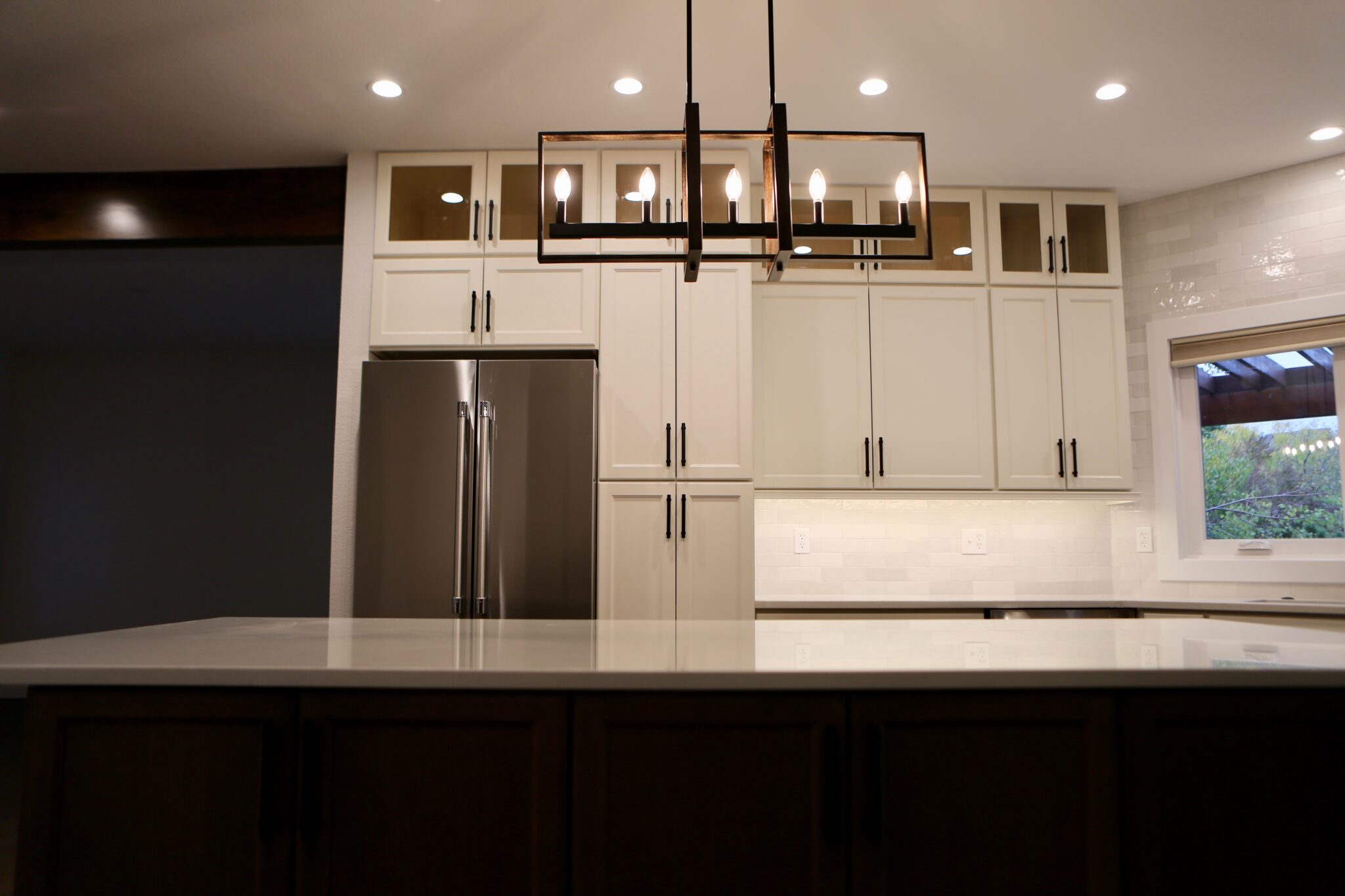  Bright kitchen with large island and elegant lighting fixture